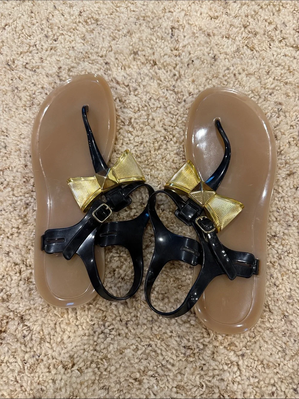 Kate Spade Women’s Black Jelly Sandals with Gold Bow Accent